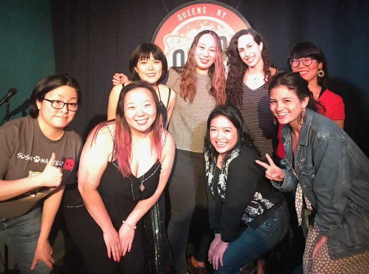 picture of comedians smiling on stage